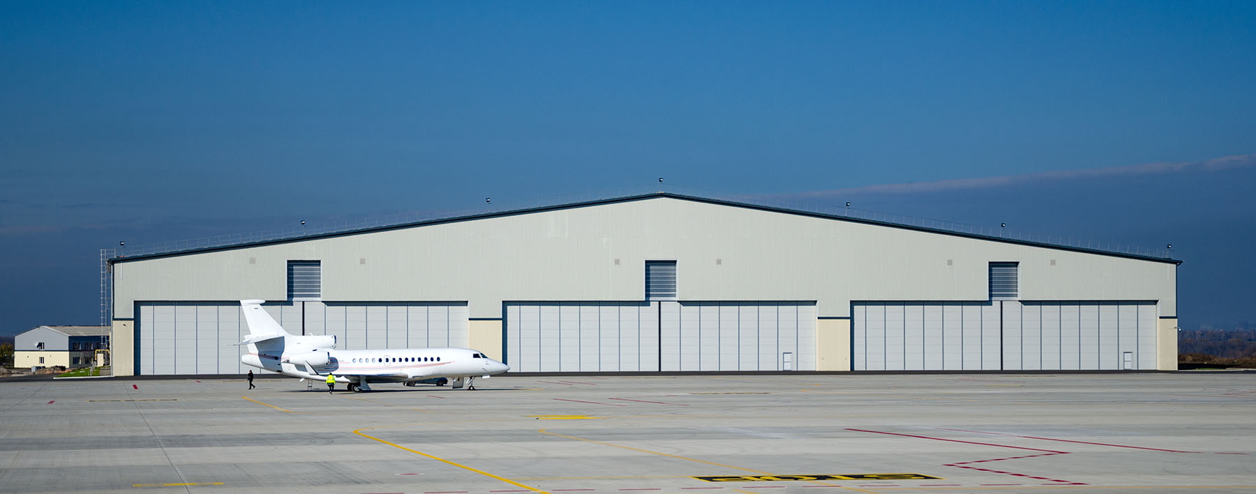 Private Aviation Hangar Building fully assembled with plane in front